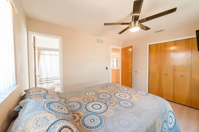 a bedroom with a bed and a dresser