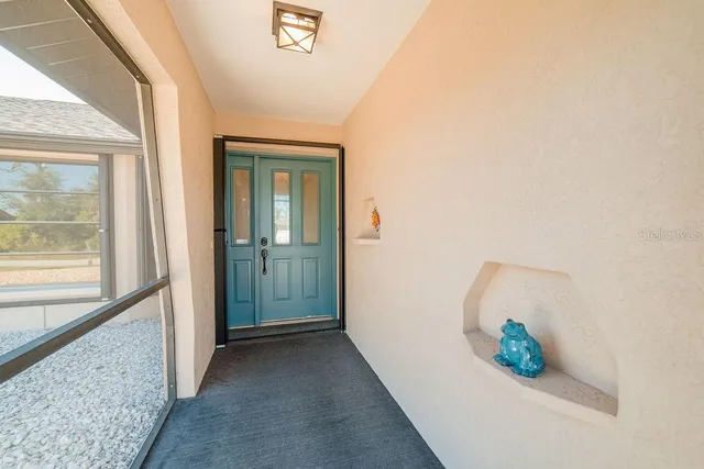 a view of a hallway to rooms