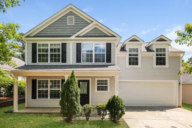 front view of a house with a yard