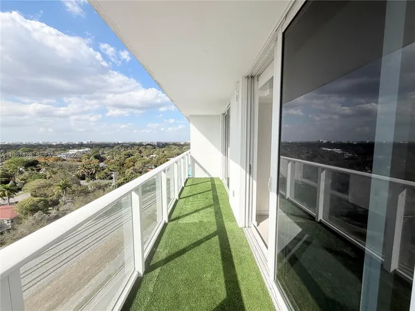 a living room with stainless steel appliances kitchen island granite countertop a table and chairs in it