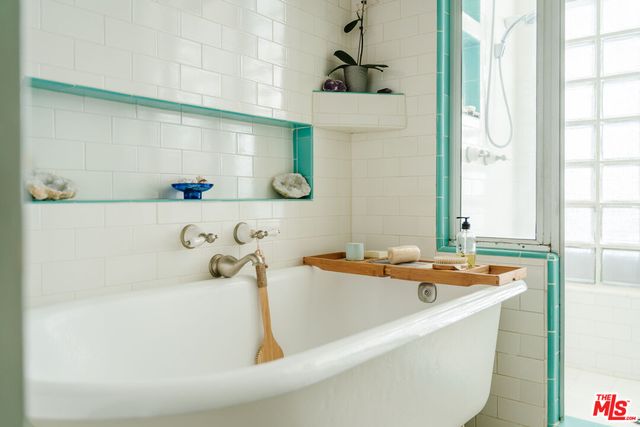 a room with window and cabinets