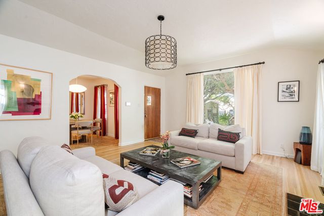 a living room with furniture and a table