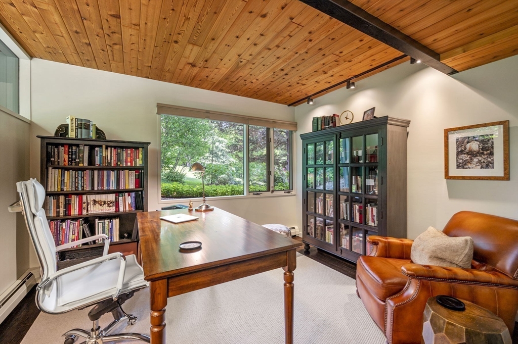 345 Cartwright Road Needham, MA 02492 - Photo 31 of 42 a room with furniture and book shelf