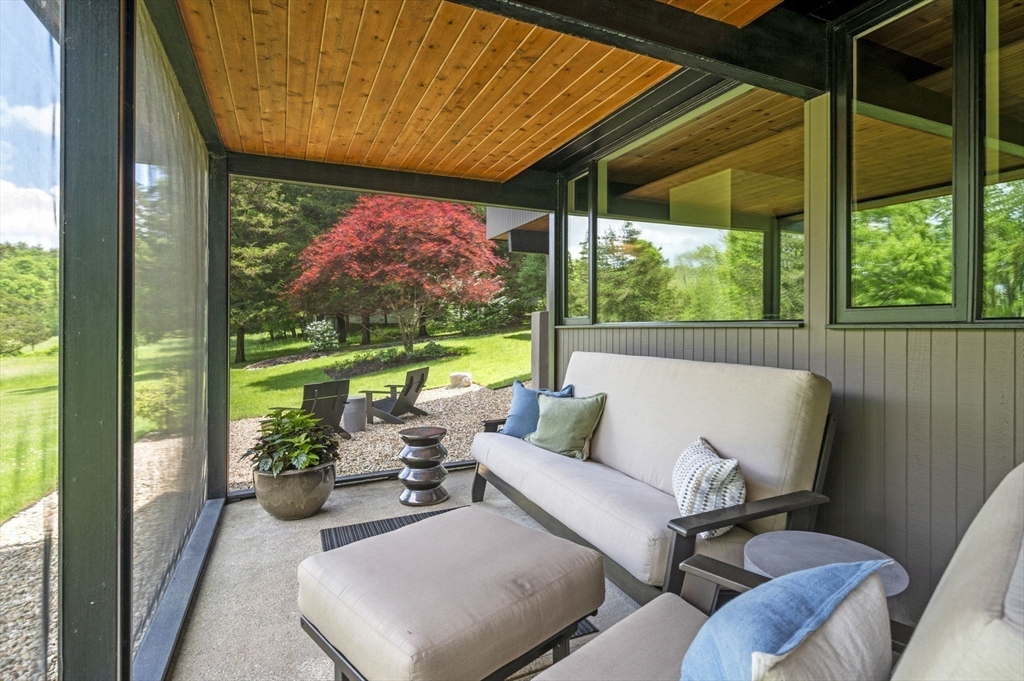 345 Cartwright Road Needham, MA 02492 - Photo 34 of 42 a balcony with furniture and garden view