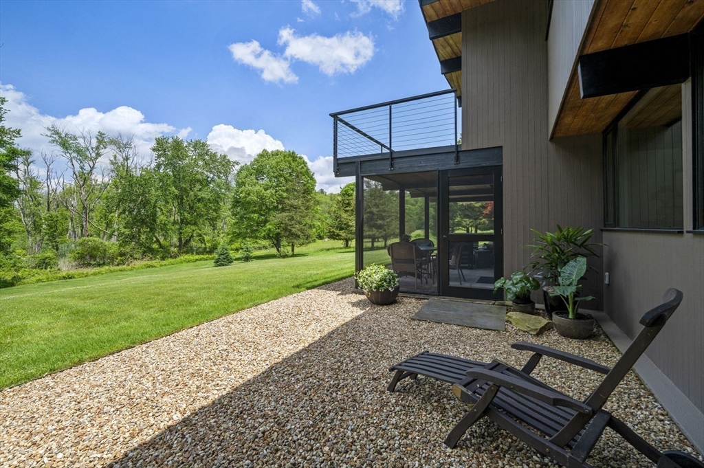 345 Cartwright Road Needham, MA 02492 - Photo 36 of 42 a view of a backyard with sitting area
