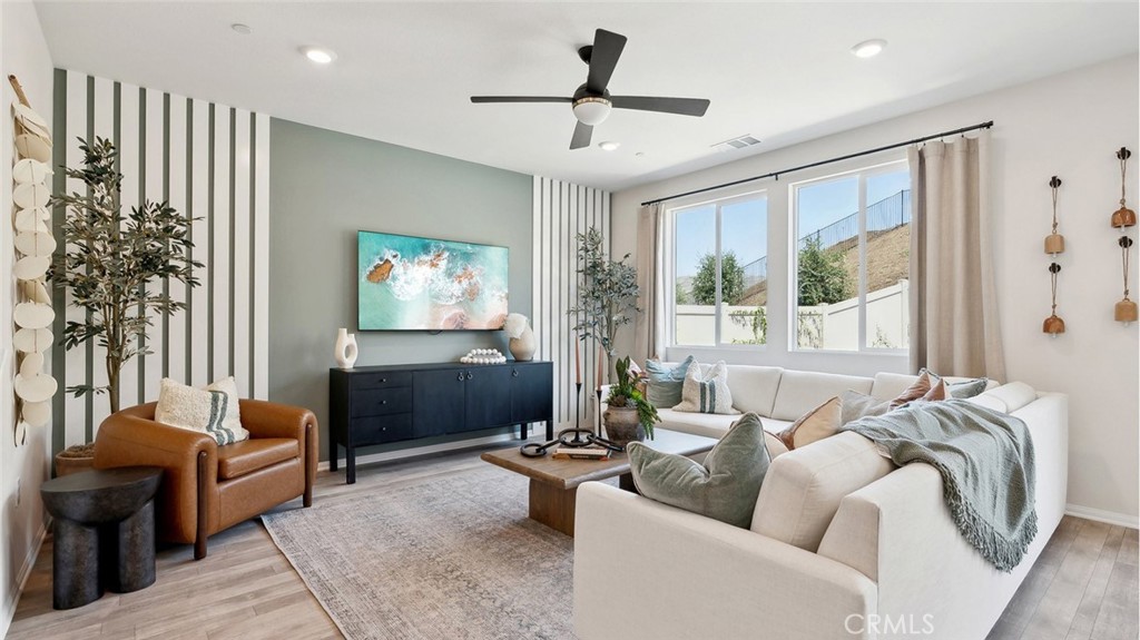 11392 Forge Road Corona, CA 92883 - Photo 2 of 24 a living room with furniture and a large window