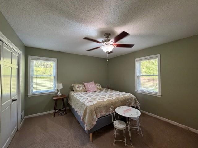 11075 Highway 57 Moscow, TN 38057 - Photo 22 of 39 a bedroom with a bed and a chandelier