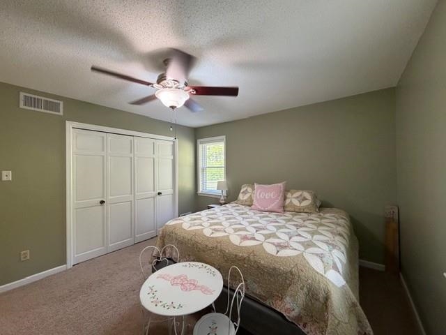 11075 Highway 57 Moscow, TN 38057 - Photo 23 of 39 a bedroom with a bed and a chandelier