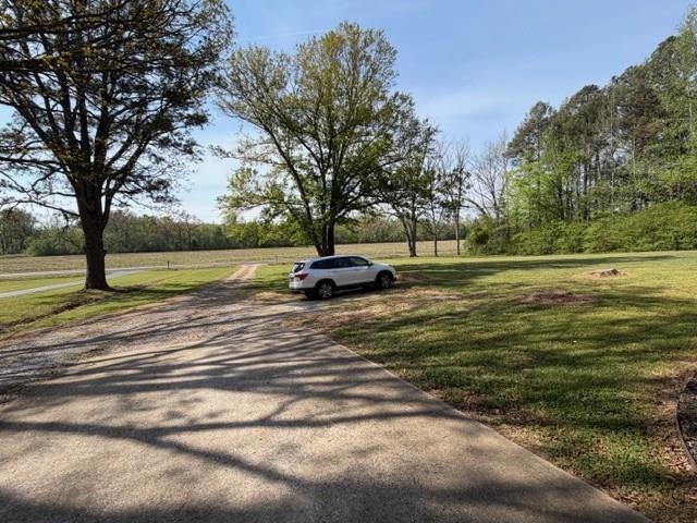 11075 Highway 57 Moscow, TN 38057 - Photo 32 of 39 a swimming pool with wooden fence
