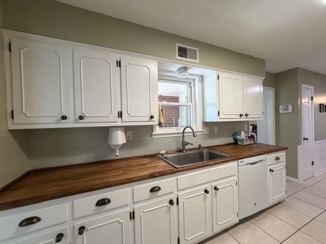 11075 Highway 57 Moscow, TN 38057 - Photo 10 of 39 a kitchen with granite countertop white cabinets and white stainless steel appliances