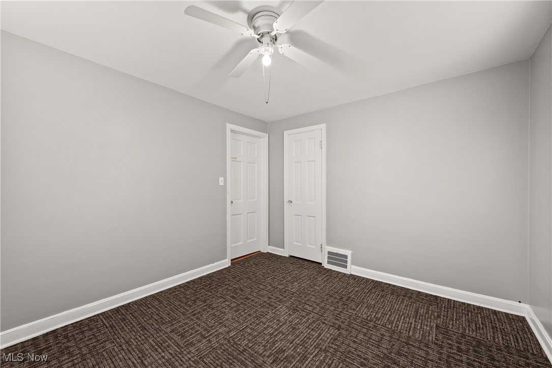4041 Wilmington Road Cleveland, OH 44121 - Photo 19 of 38 Empty room featuring carpet floors and ceiling fan