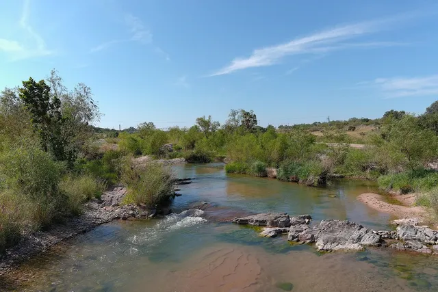 an aerial view of a houses with ocean view