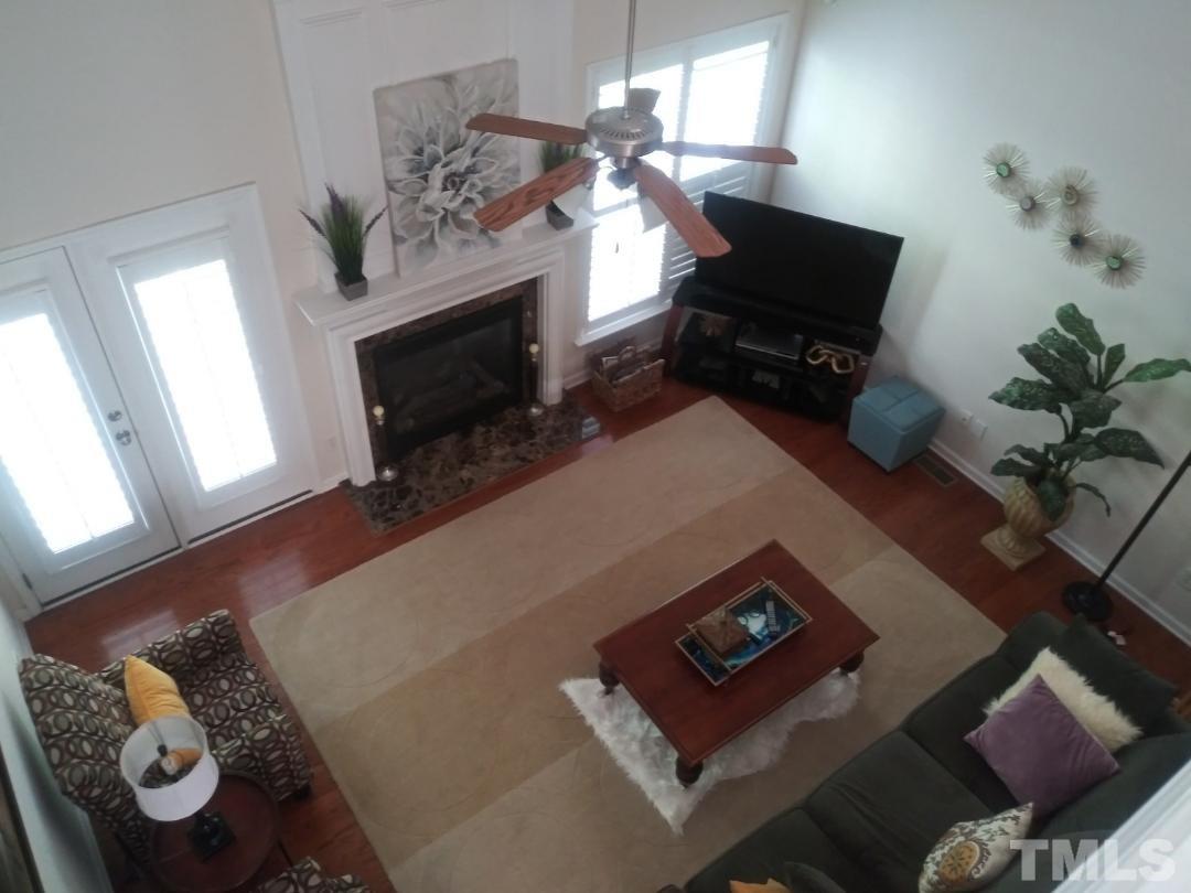 5020 Isabella Cannon Drive Raleigh, NC 27612 - Photo 17 of 29 Gas Fireplace - walk out to deck