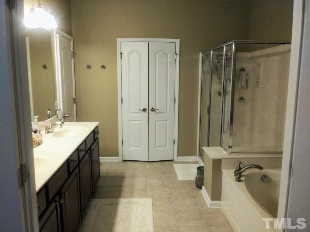 5020 Isabella Cannon Drive Raleigh, NC 27612 - Photo 18 of 29 Double sink -Shower- tub and lead to custom walk-in-closet