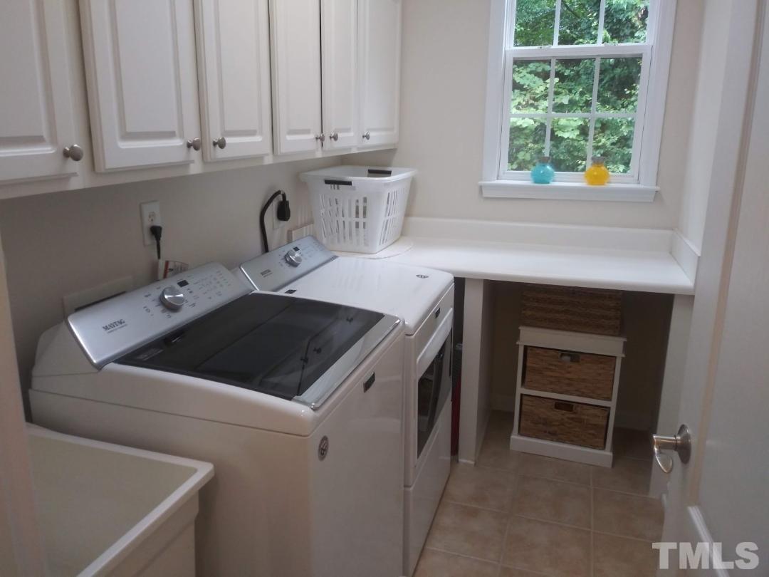 5020 Isabella Cannon Drive Raleigh, NC 27612 - Photo 20 of 29 Main floor laundry room with sink and counter top