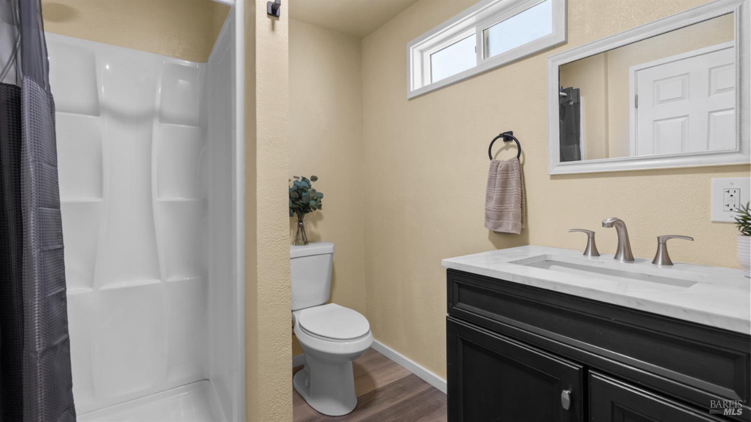 125 Kendal Street Vacaville, CA 95688 - Photo 39 of 45 a bathroom with a sink a toilet and a mirror