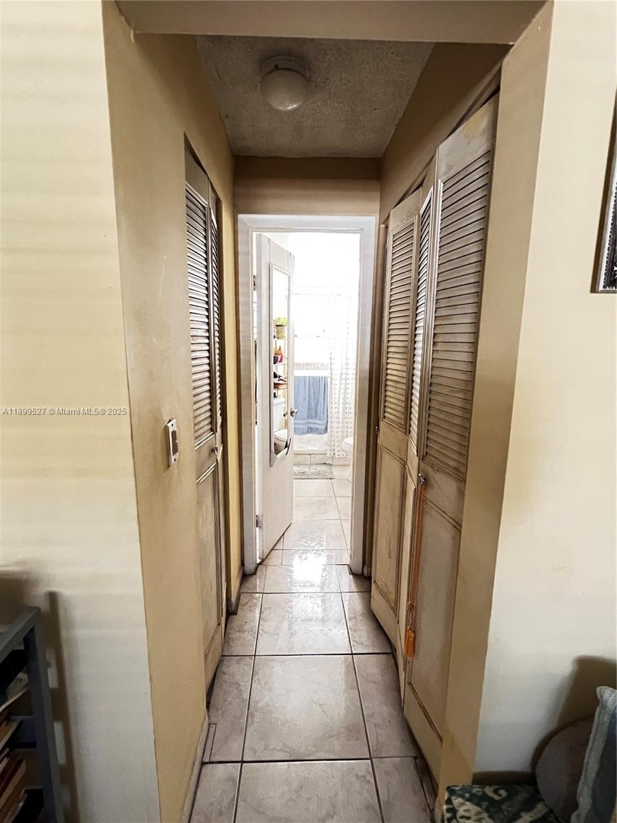 14175 Southwest 87th Street, Unit C208 Miami, FL 33183 - Photo 7 of 8 a view of a hallway