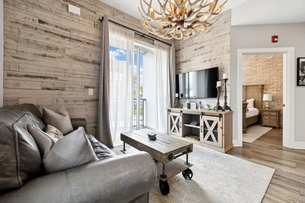 a living room with furniture and a flat screen tv