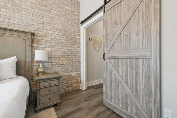 a bedroom with a bed and a furniture