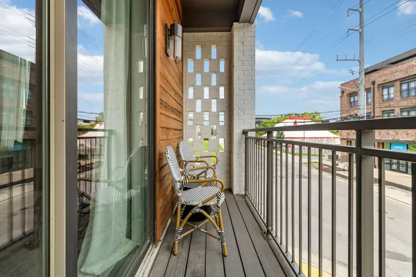 a view of a balcony with wooden floor