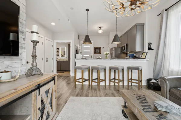 a large kitchen with a table and chairs