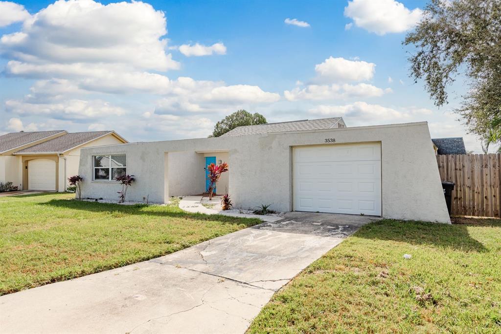 3538 Bluebell Lane Holiday, FL 34691 - Photo 1 of 25 a front view of house with yard