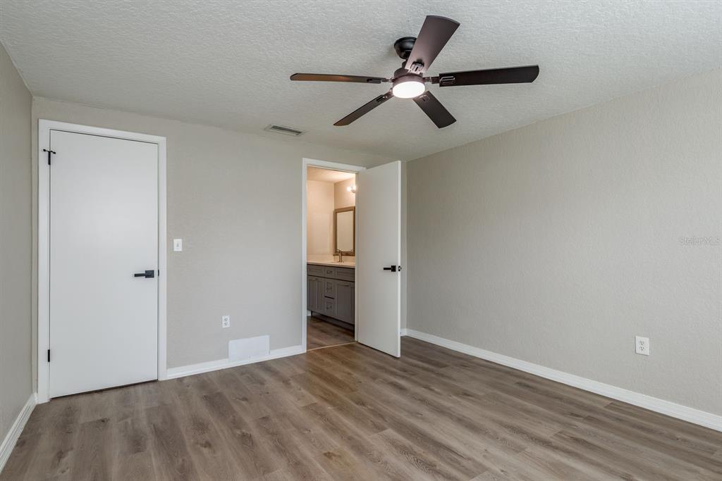 3538 Bluebell Lane Holiday, FL 34691 - Photo 12 of 25 a view of an empty room and wooden floor