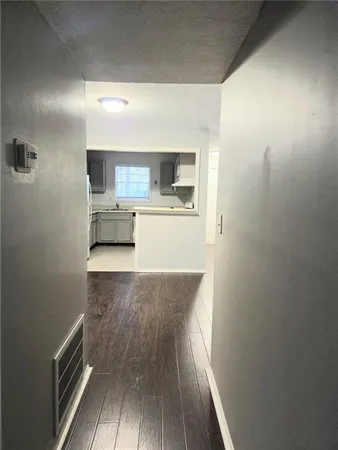 a view of a kitchen from the hallway
