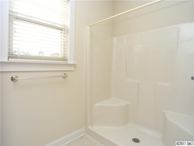 16509 Knox Run Road Huntersville, NC 28078 - Photo 12 of 16 a bathroom with a shower and a bathtub