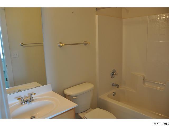 16509 Knox Run Road Huntersville, NC 28078 - Photo 14 of 16 a bathroom with a sink a toilet and shower