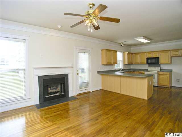 16509 Knox Run Road Huntersville, NC 28078 - Photo 6 of 16 a kitchen with a refrigerator and a stove top oven