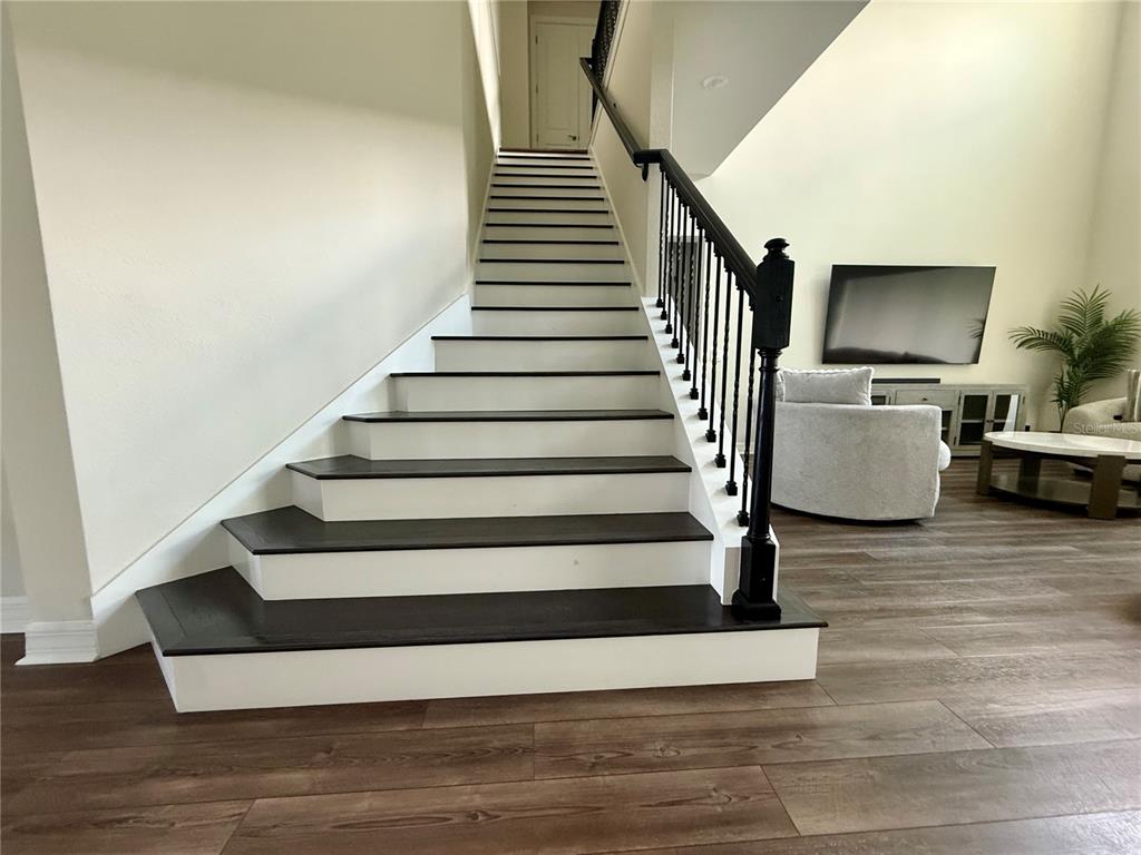 8441 Pk Clf Way Orlando, FL 32836 - Photo 11 of 59 a view of entryway and hall with wooden floor