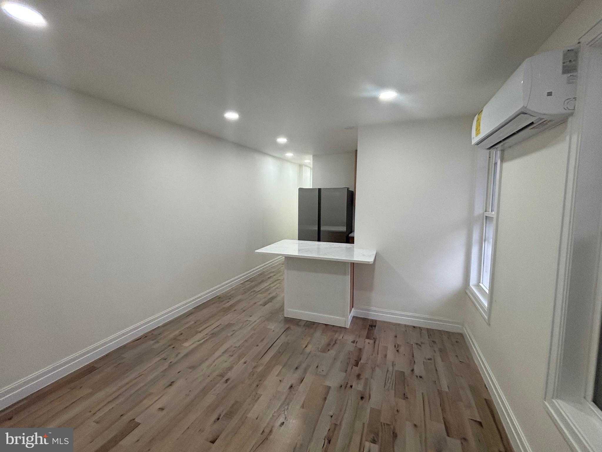 1120 Elm Street, Unit 2R Reading, PA 19604 - Photo 5 of 7 a view of a kitchen with a sink and a refrigerator