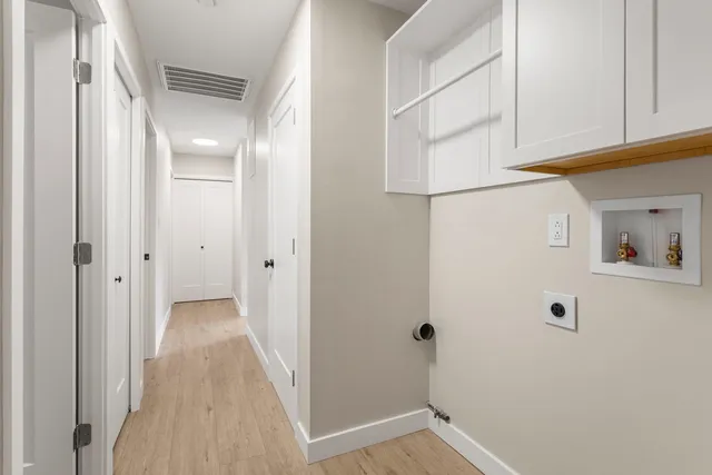 a view of a hallway with closet
