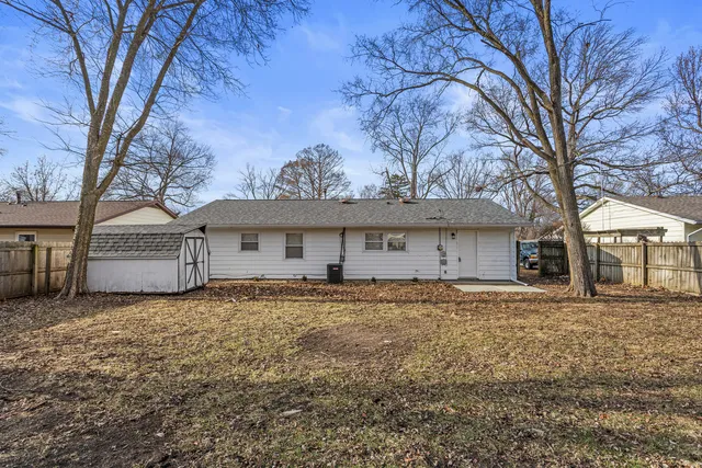 a house that has a tree in front of it