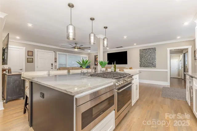 a kitchen with a stove and a sink