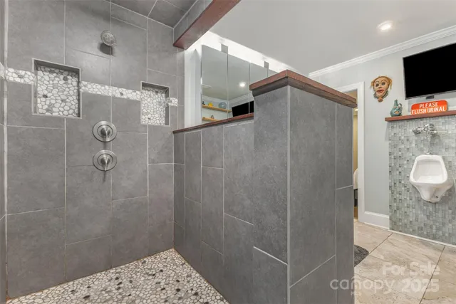 a bathroom with a shower and a sink