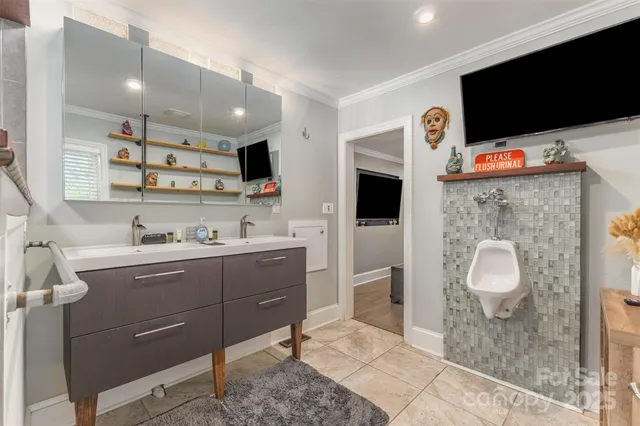 a spacious bathroom with a sink a mirror and shower