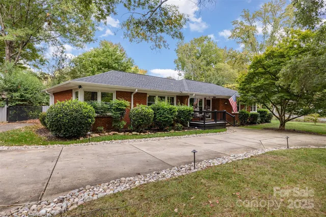 a front view of a house with a yard and a garage