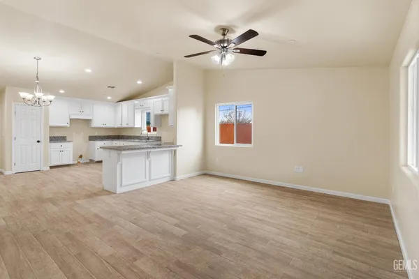a view of kitchen with wooden floor and window