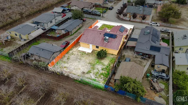 an aerial view of house with a yard