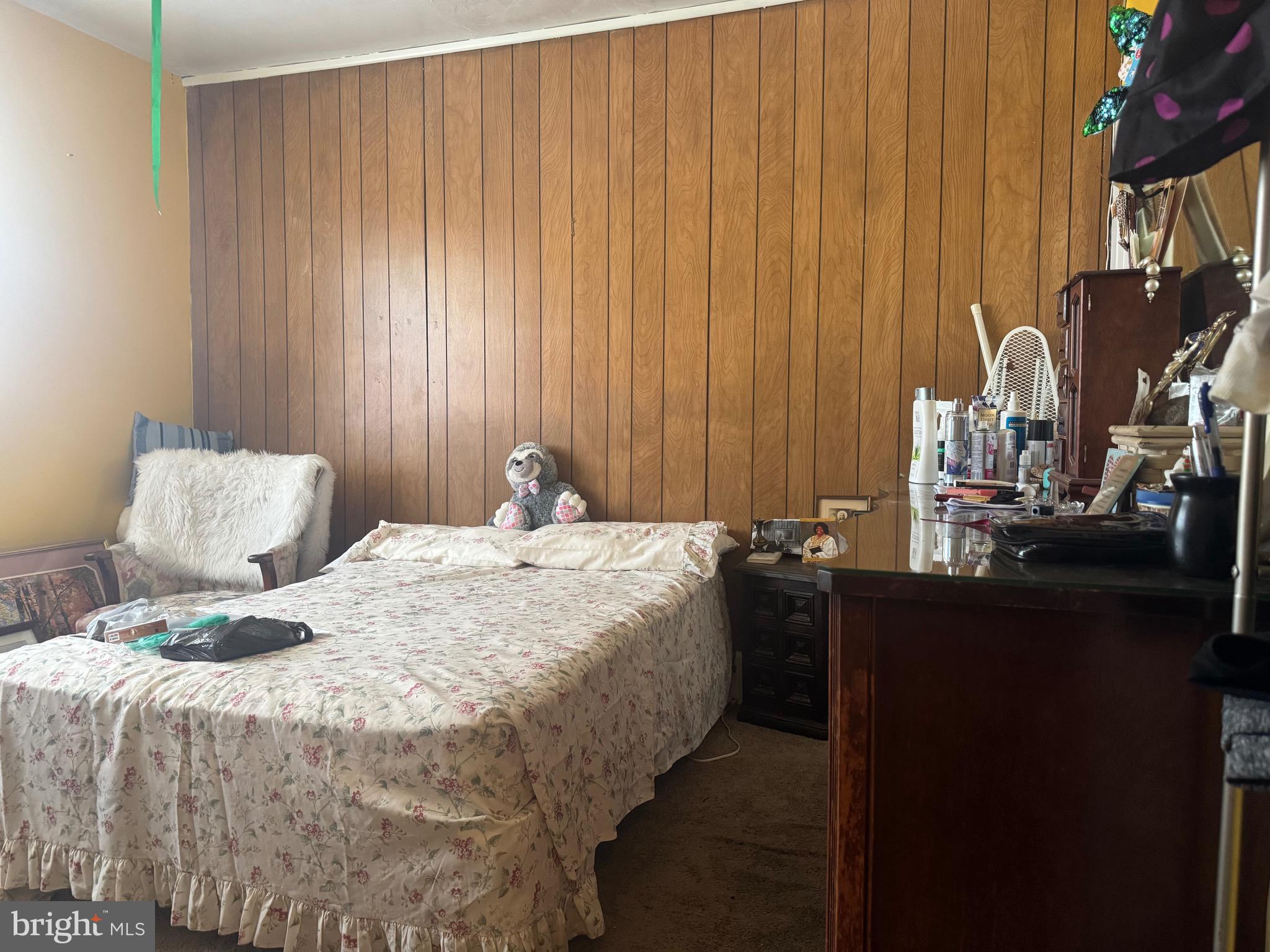 2214 North Monroe Street Baltimore, MD 21217 - Photo 12 of 19 a bedroom with a bed and a lamp on the table