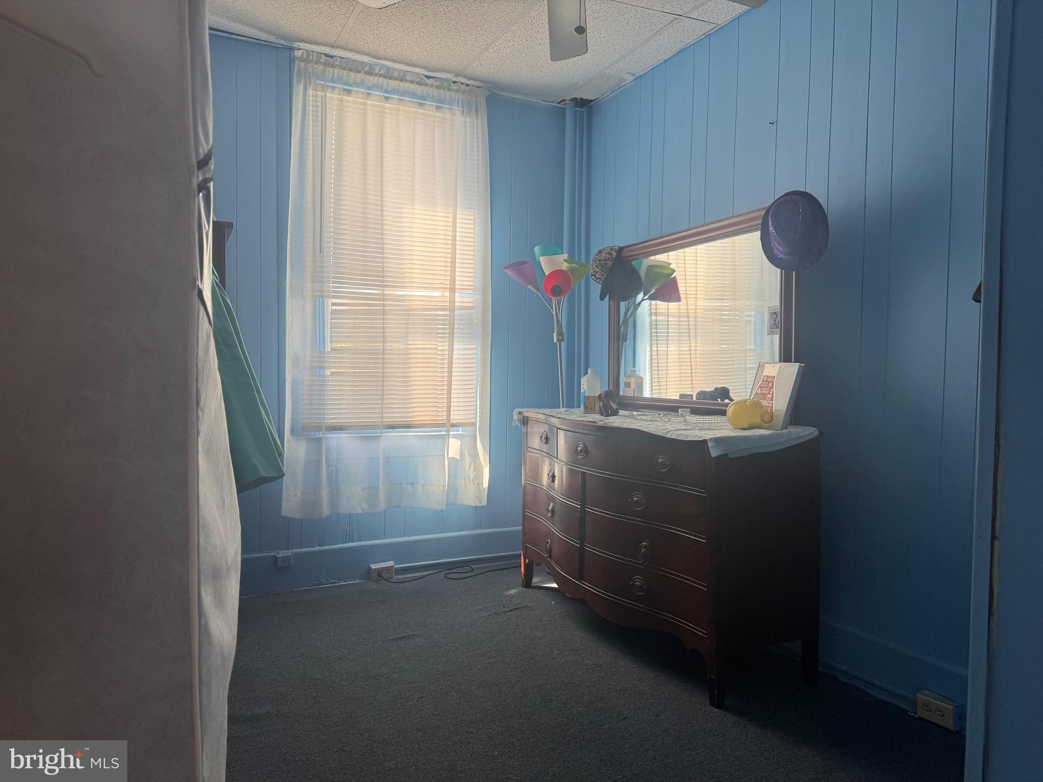 2214 North Monroe Street Baltimore, MD 21217 - Photo 13 of 19 a room with a dresser and a window