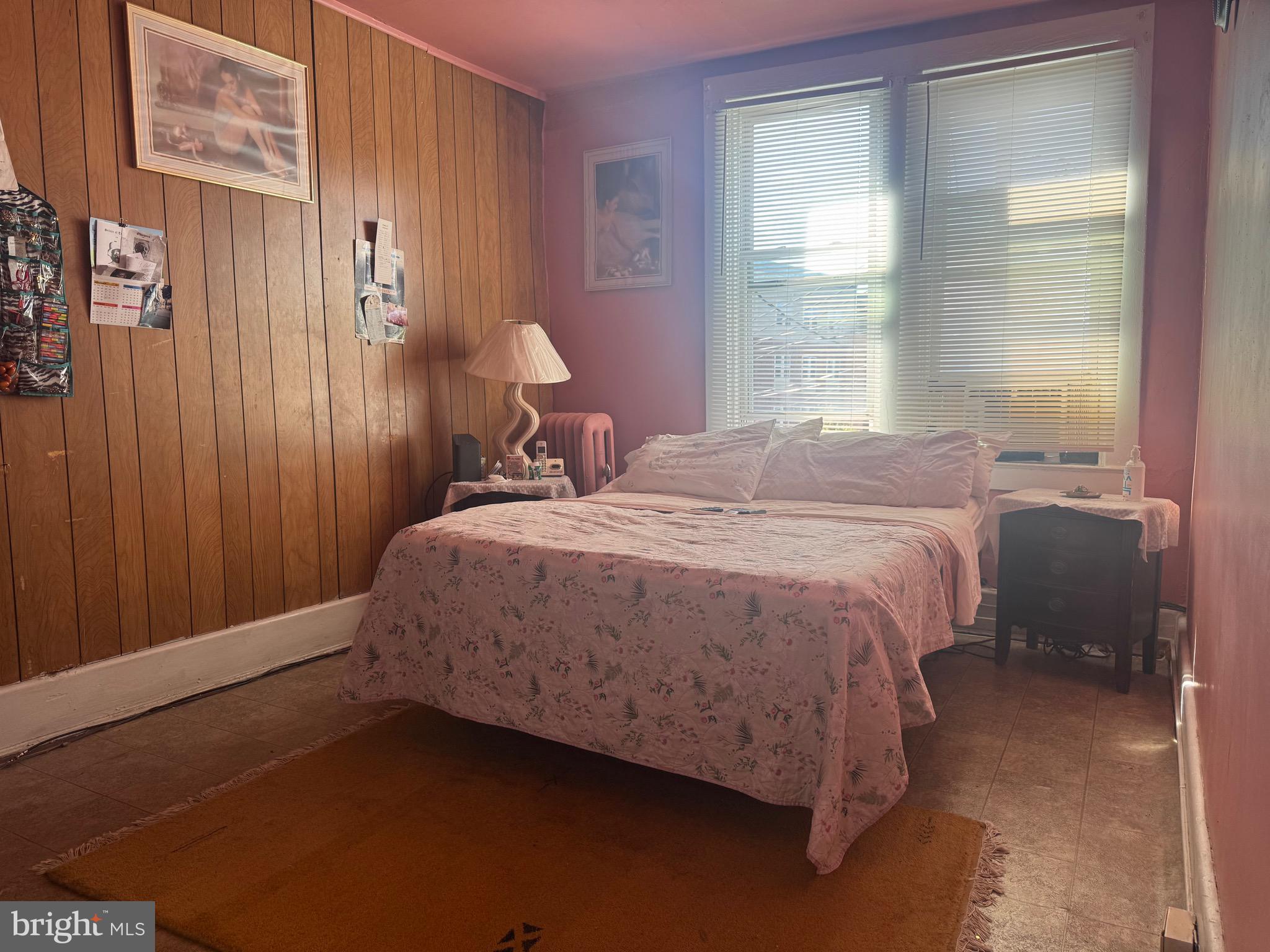 2214 North Monroe Street Baltimore, MD 21217 - Photo 14 of 19 a bed sitting in a bedroom next to a window