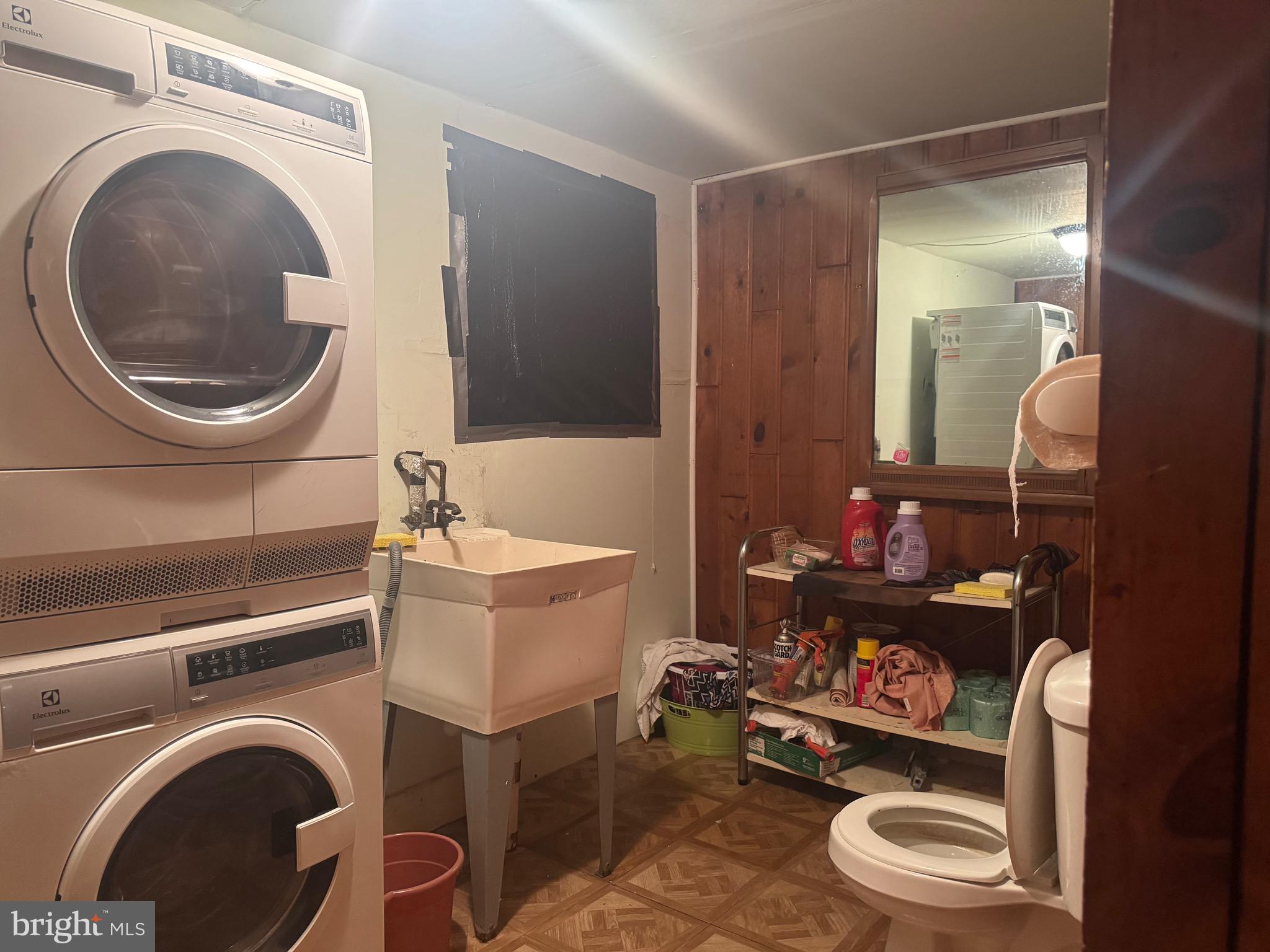 2214 North Monroe Street Baltimore, MD 21217 - Photo 18 of 19 a bathroom with a toilet a sink and a mirror