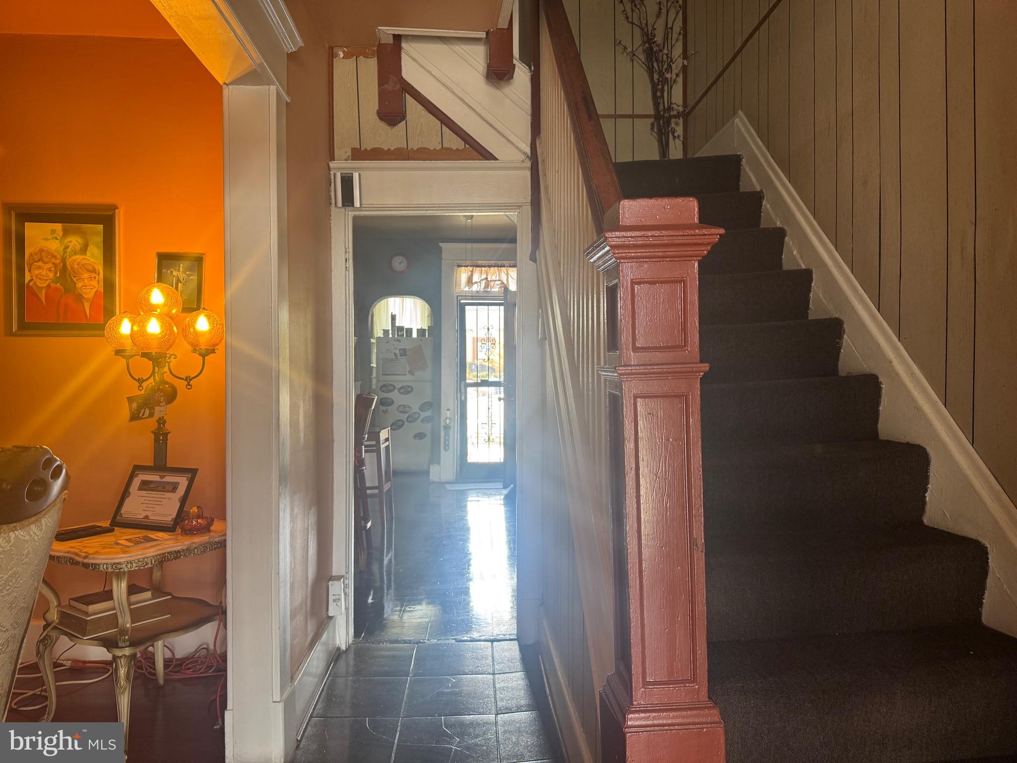 2214 North Monroe Street Baltimore, MD 21217 - Photo 2 of 19 a view of a hallway with wooden floor and entryway