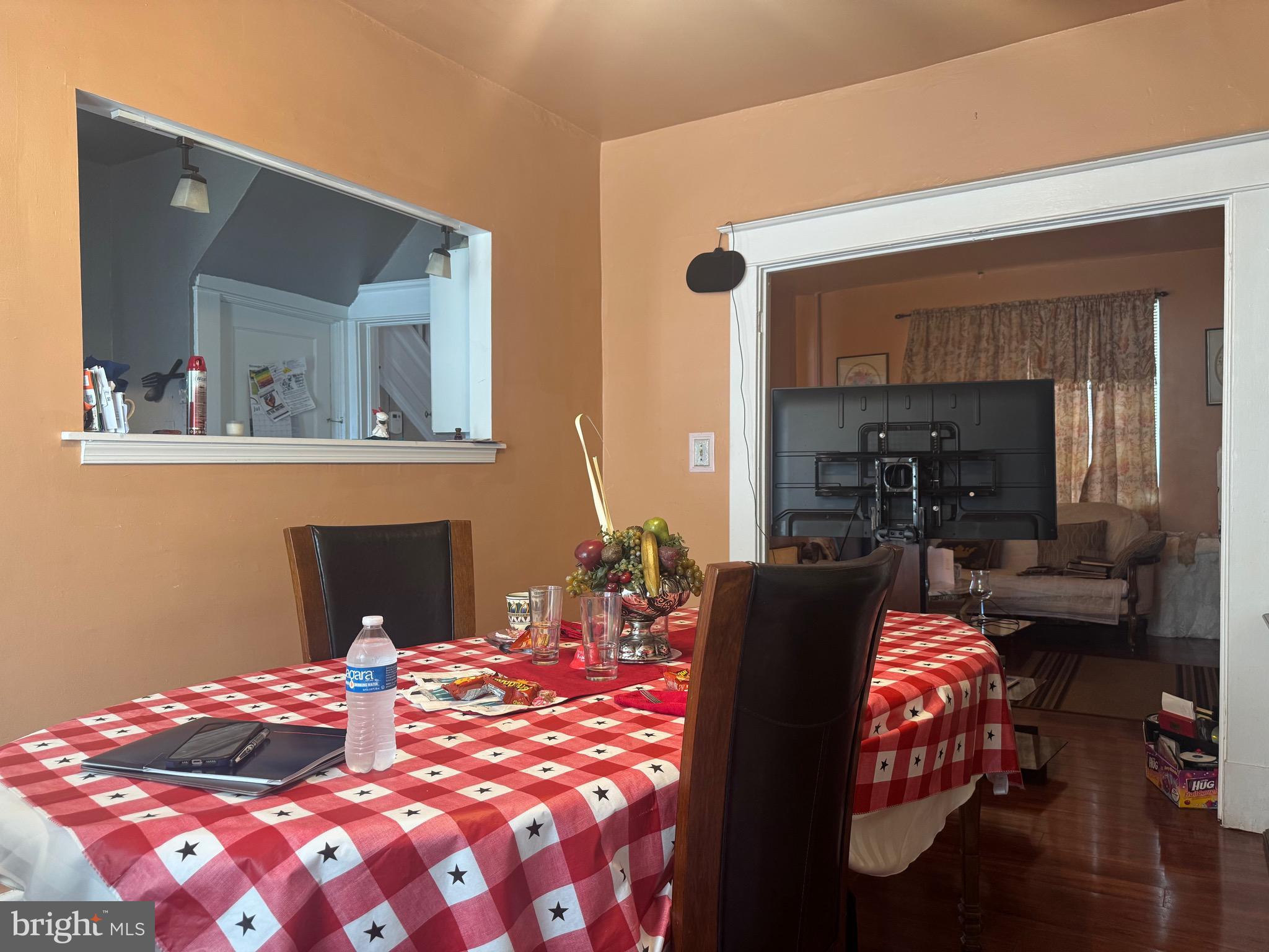2214 North Monroe Street Baltimore, MD 21217 - Photo 7 of 19 a bedroom with furniture and a fireplace