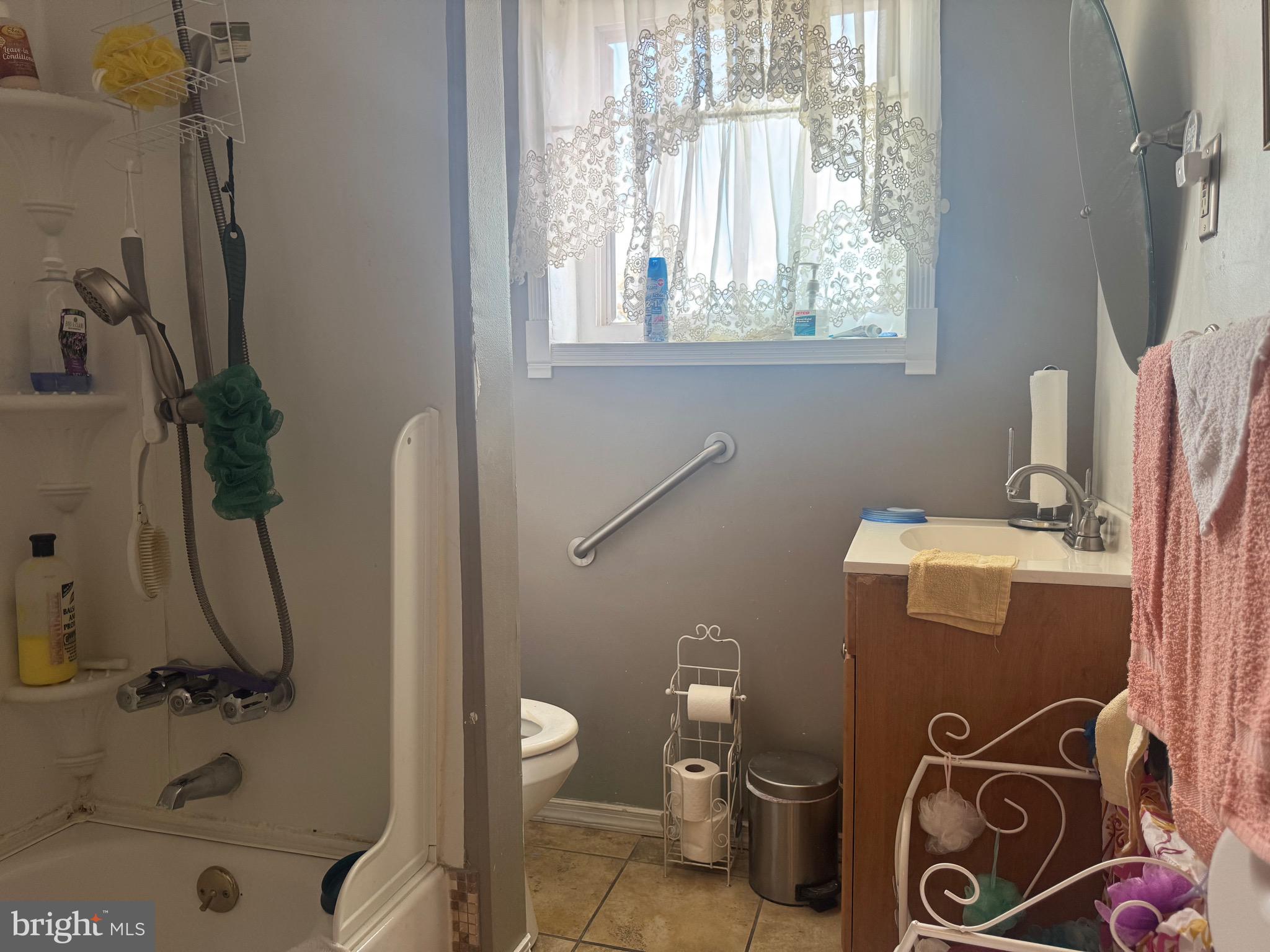 2214 North Monroe Street Baltimore, MD 21217 - Photo 10 of 19 a bathroom with a toilet and a sink