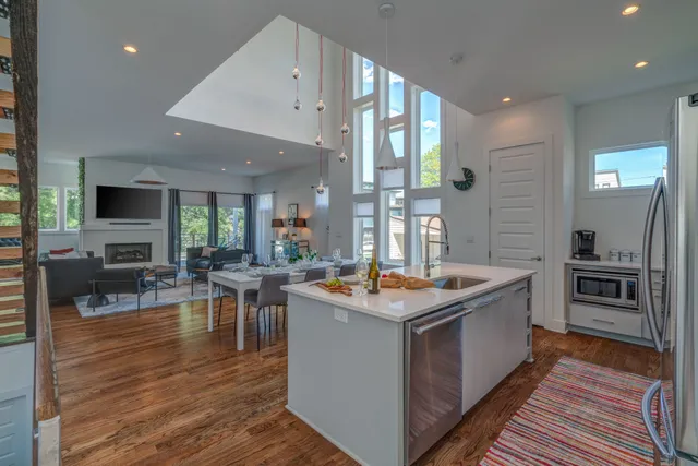 a kitchen with stainless steel appliances granite countertop a sink and cabinets