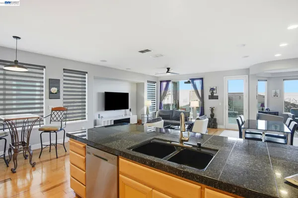 a kitchen with a sink and a refrigerator